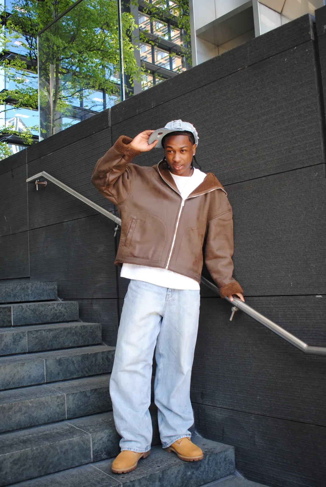 Denim look — brown shearling jacket, baggy light wash jeans and reworked LA denim cap